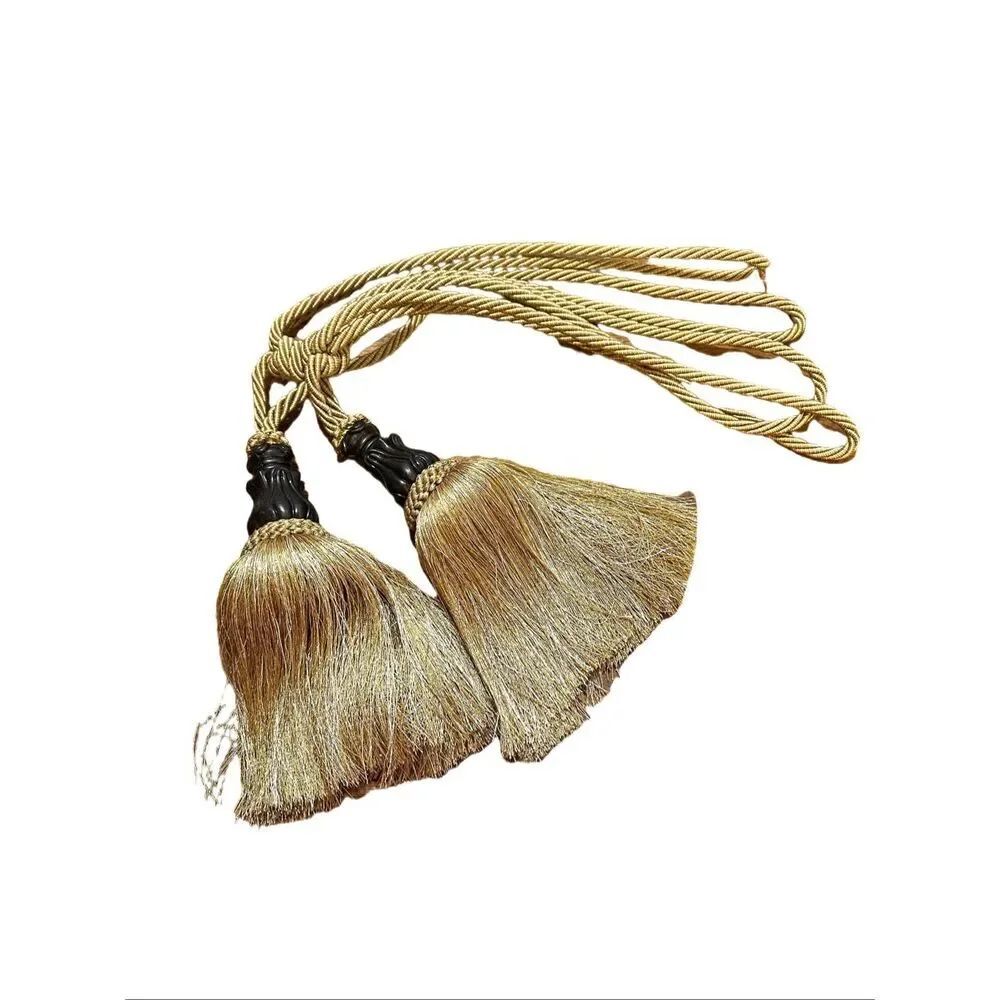 Two Oversized Golden Tassels